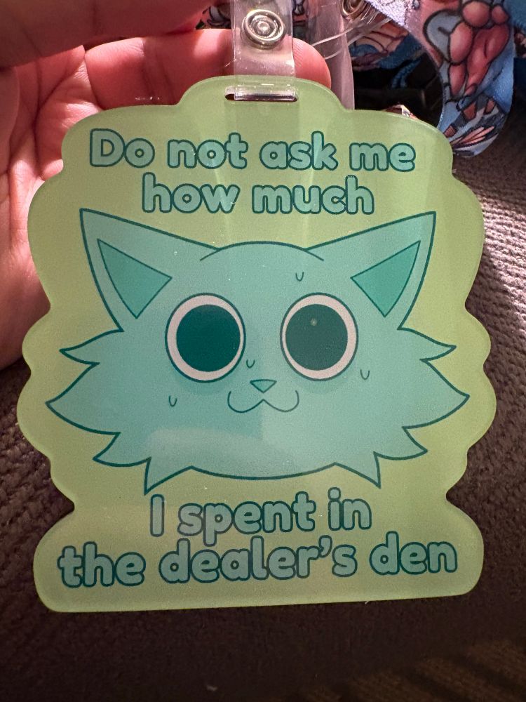 Furry themed badge with a nervous furry sweating. The badge states, “Do not ask me how much I spent in the dealer’s den”