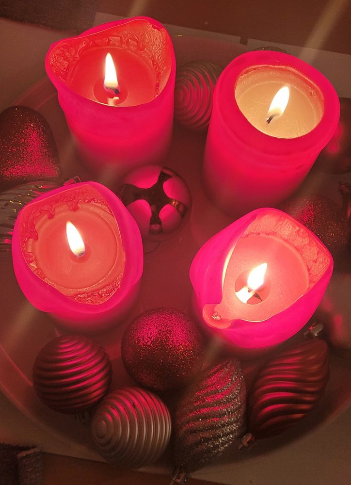 Four red candles burn. They are the symbols of the four weeks for Christmas. 