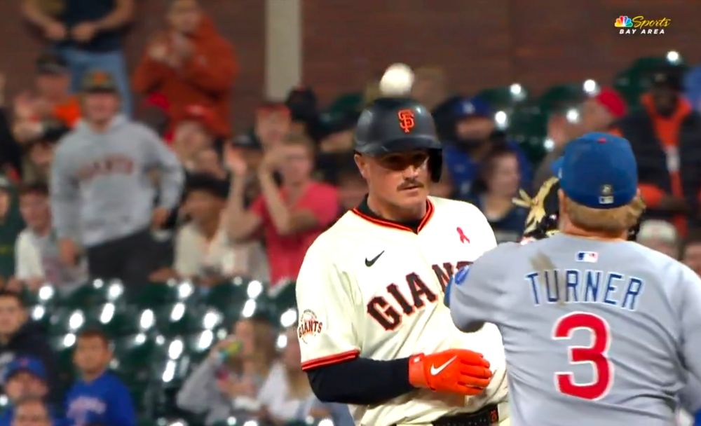 Matt Chapman gets doinked in the head by a throw from Cubs RF Kyle Tucker, leading to a bonus run. Presumably circus music is playing in the background. 