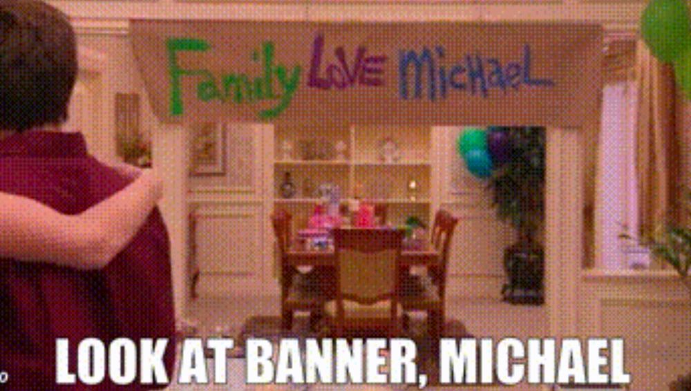 Arrested Development screenshot of banner reading "Family Love Michael" with Gob saying "Look at banner, Michael" 