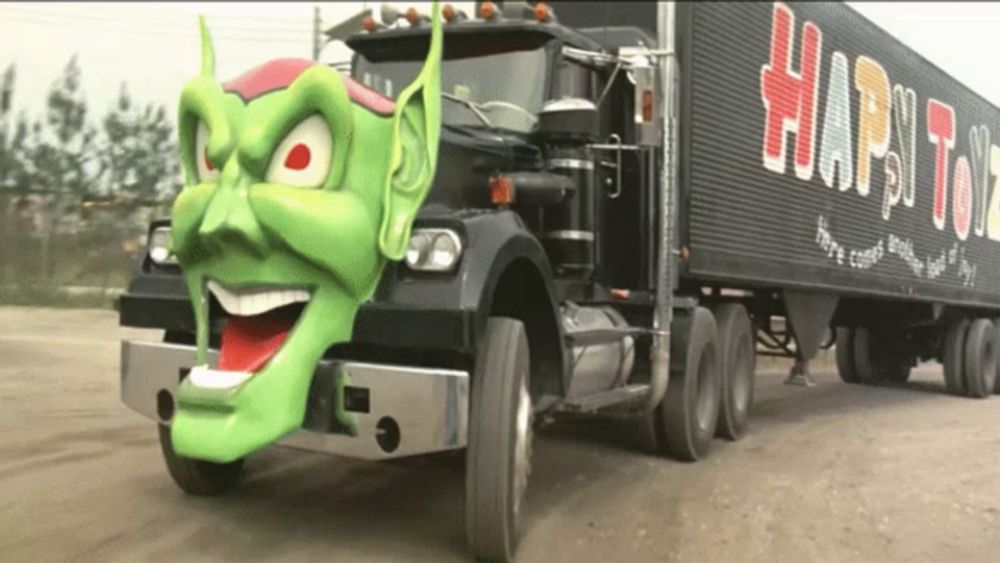 a truck with a green face and the word happy on the side of it