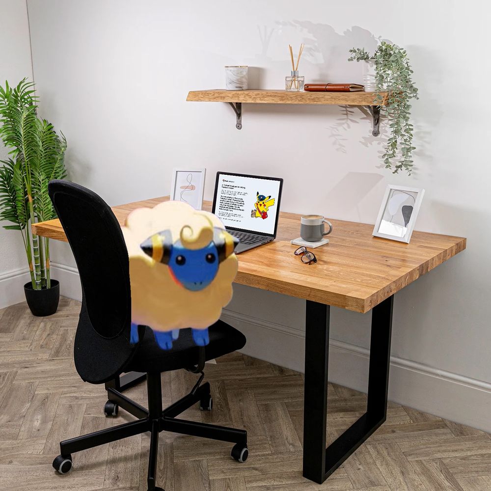 A photoshopped image of a Mareep sitting on an office chair next to a laptop showing the Pokémon Center queue message