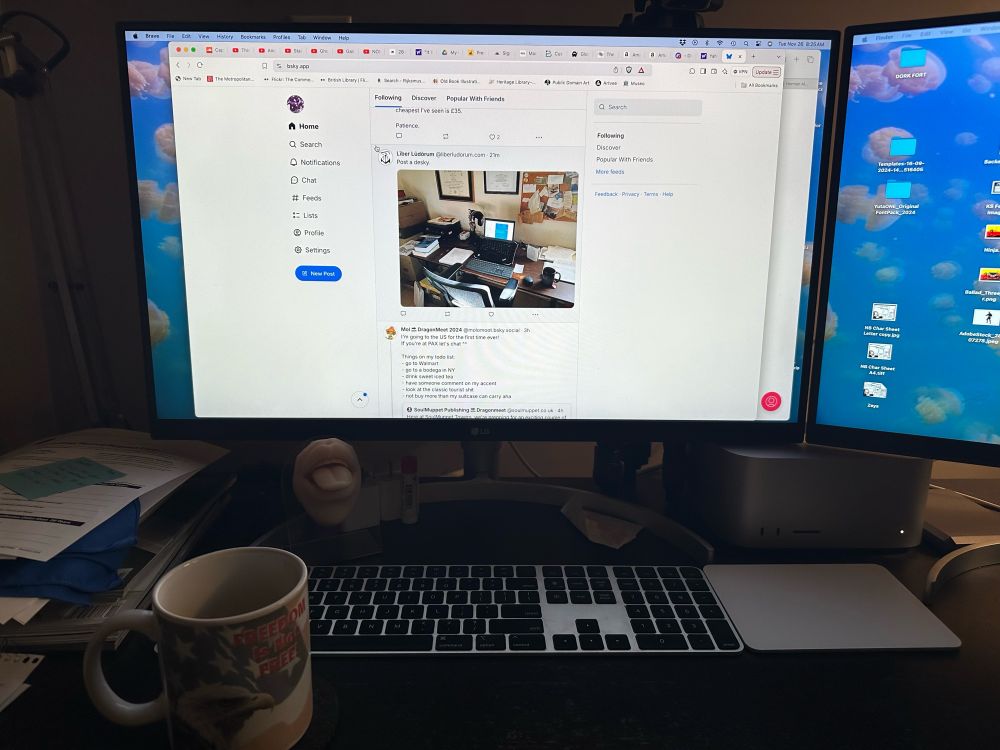 My desk, monitor, keyboard, trackpad, a tongue piercing practice model, and my dad’s incredibly stupid Freedom is not free! mug that I stole from the house when he died. 