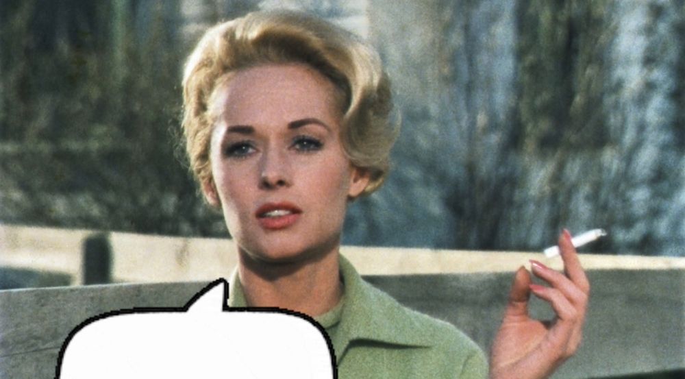 Melanie Daniels (Tippi Hedren) smokes a cigarette on a cool afternoon in a still from Alfred Hitchcock’s 1963 thriller The Birds