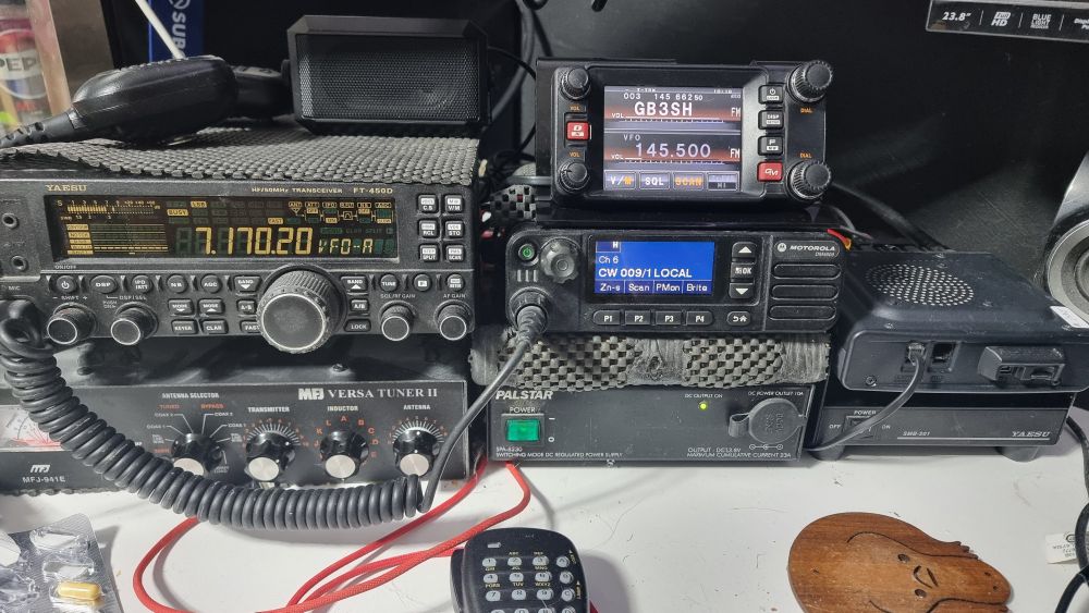 A picture of my home base radios. A Yaesu FT-450D, an FTM-400 and a Motorola DM4600 UHF for DMR only