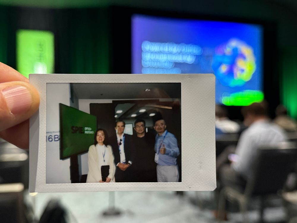 Picuture of an instant picture with four scientists at a conference in San Diego