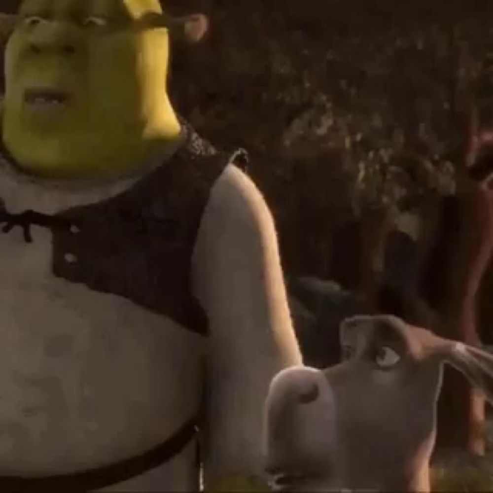 shrek from shrek is standing next to a dog in the woods .