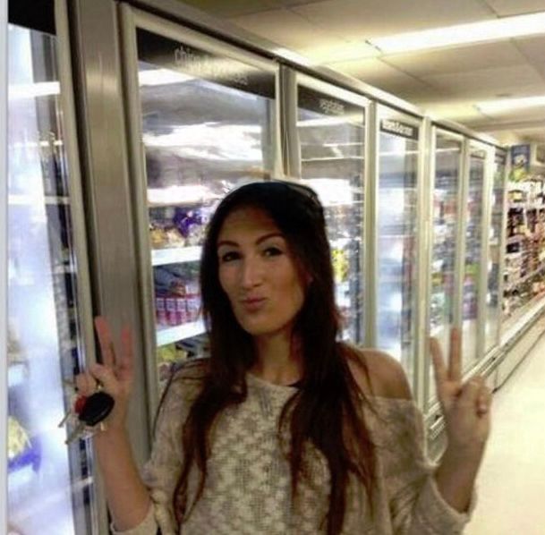 a lady in the grocery store with nothing on her head 