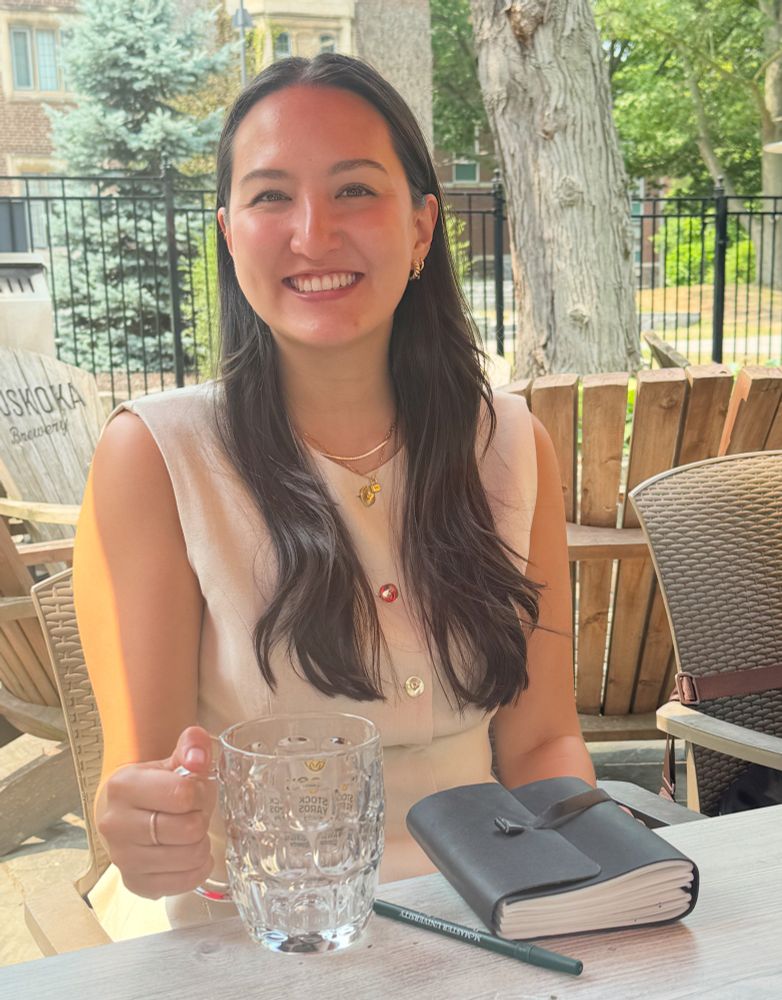Dr. Warner at the traditional post-defense celebration at the Phoenix with the book of wisdom and "substitute" PhD chalice.