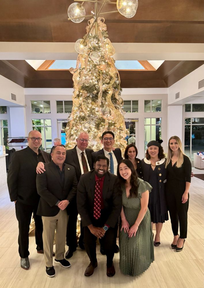 Group picture in front of a lavishly decorated Christmas tree 

L to R: Ken Ziegler, Chris Ochoa, Fred Weaver, Anand Ganapathy, Sukgu Han, Ashley Hsu, Ariela Zenilman, Laura Shin, Anastasia Plotkin.