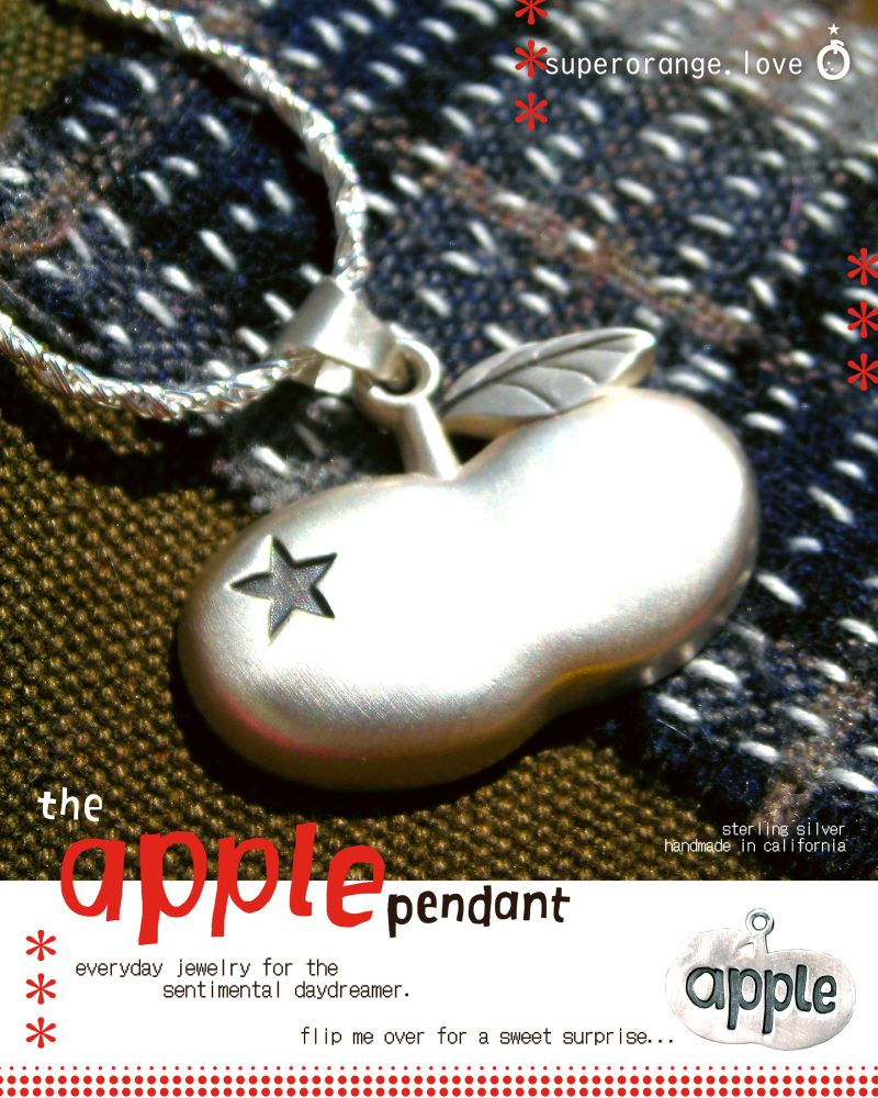ad for the apple pendant by superorange. sterling silver wide apple shape with an engraved star on the left side. text reads: 
the apple pendant. everyday jewelry for the sentimental daydreamer. flip me over for a sweet surprise... (image of the back of the pendant, which has the word apple engraved in handwritten font) 