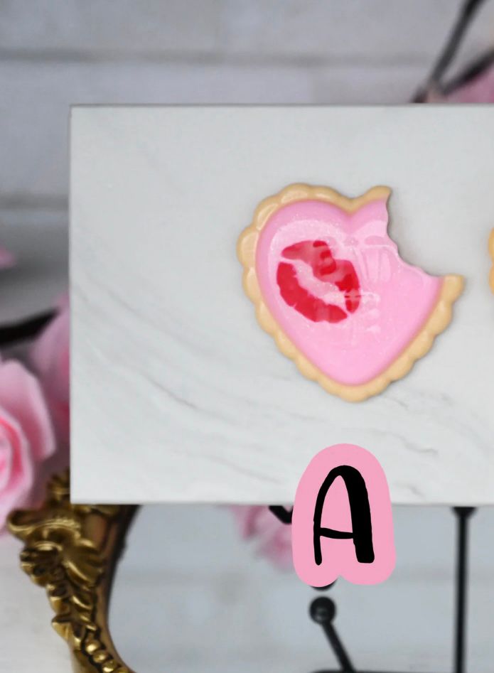 Valentine’s Day cookie squish from CC; pink frosting with red lipstick mark