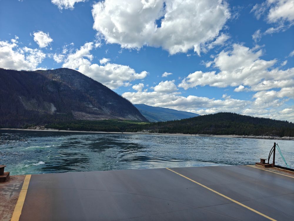 View of the lake and mountains from the stern of the Upper Arrow Lake Ferry leaving Shelter Bay.