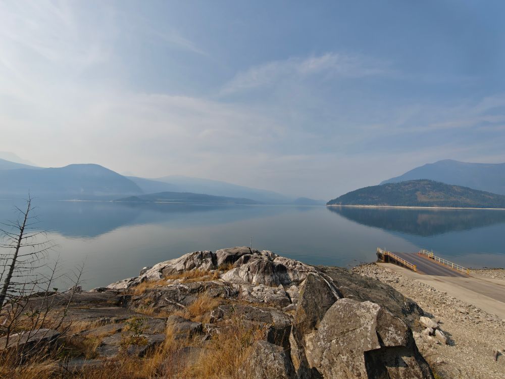 View of Upper Arrow Lake on a sunny day at the Galena Bay Ferry dock. 