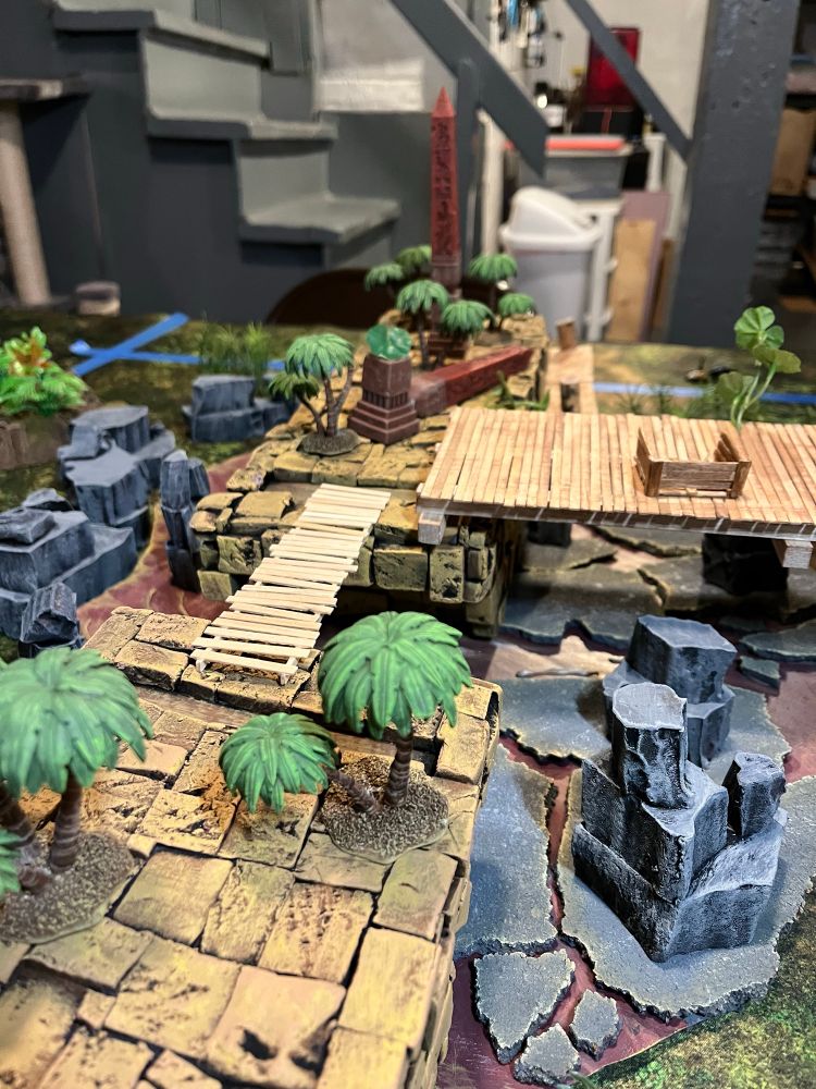 A bit closer up shot of the bridge - including a closer up shot of the painted palm trees “growing” out of the bridge stones