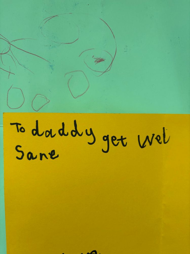 Get well soon card made by my kids on yellow and green card saying, “To daddy get wel sane”.