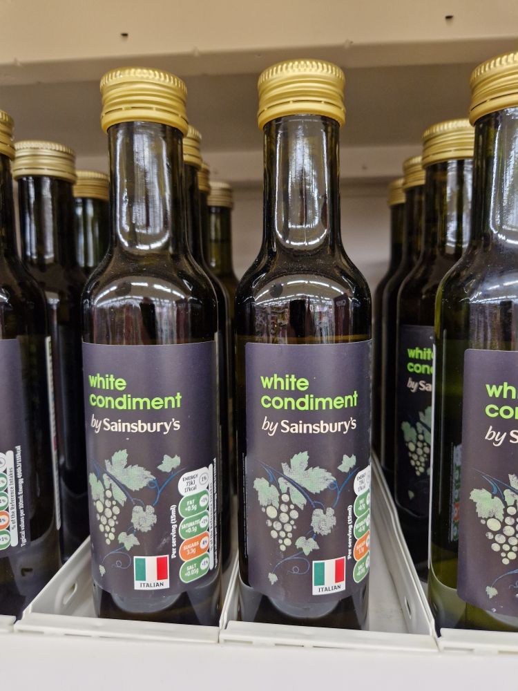 Photo of some bottles on a shelf in a Sainsbury's supermarket. The label reads: 