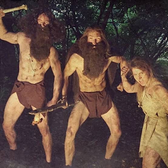 2 cavemen and 1 cavewoman (in very pathetic  caveperson costumes!) 
