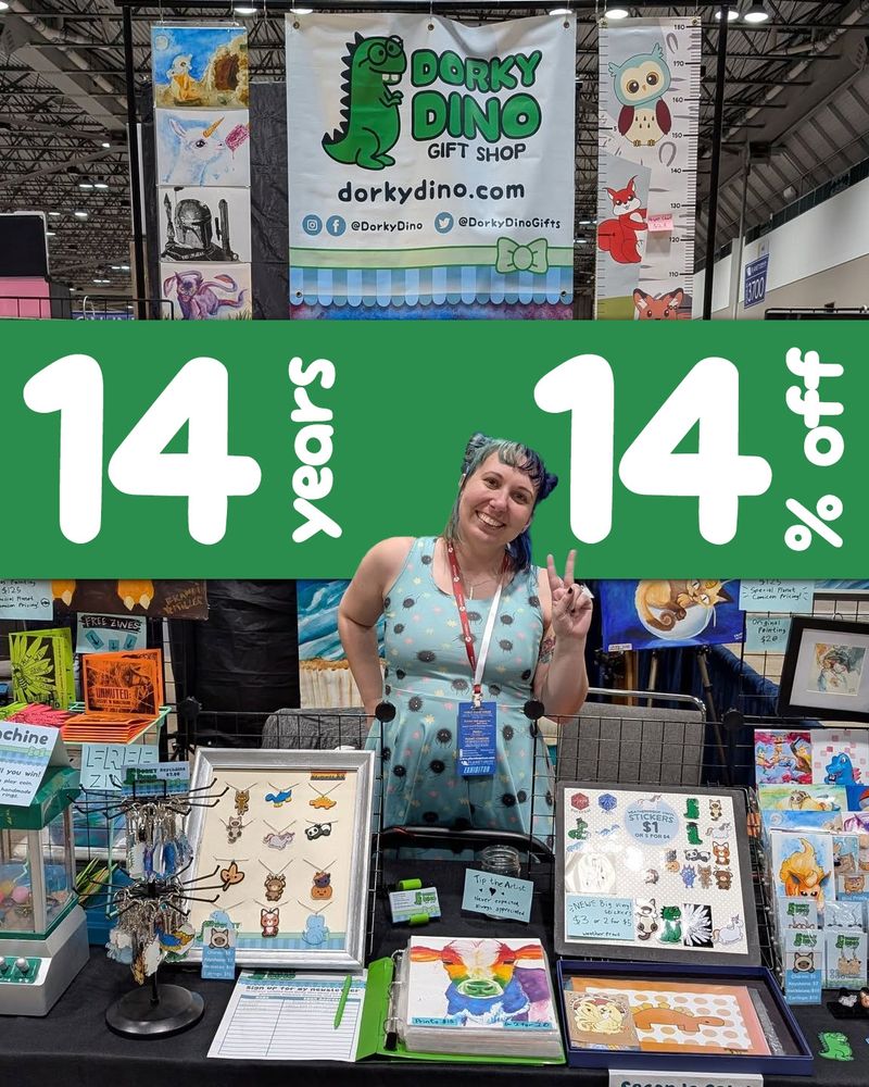 A photo of the Dorky Dino bioth at a convention with the words "14 years 14% off"