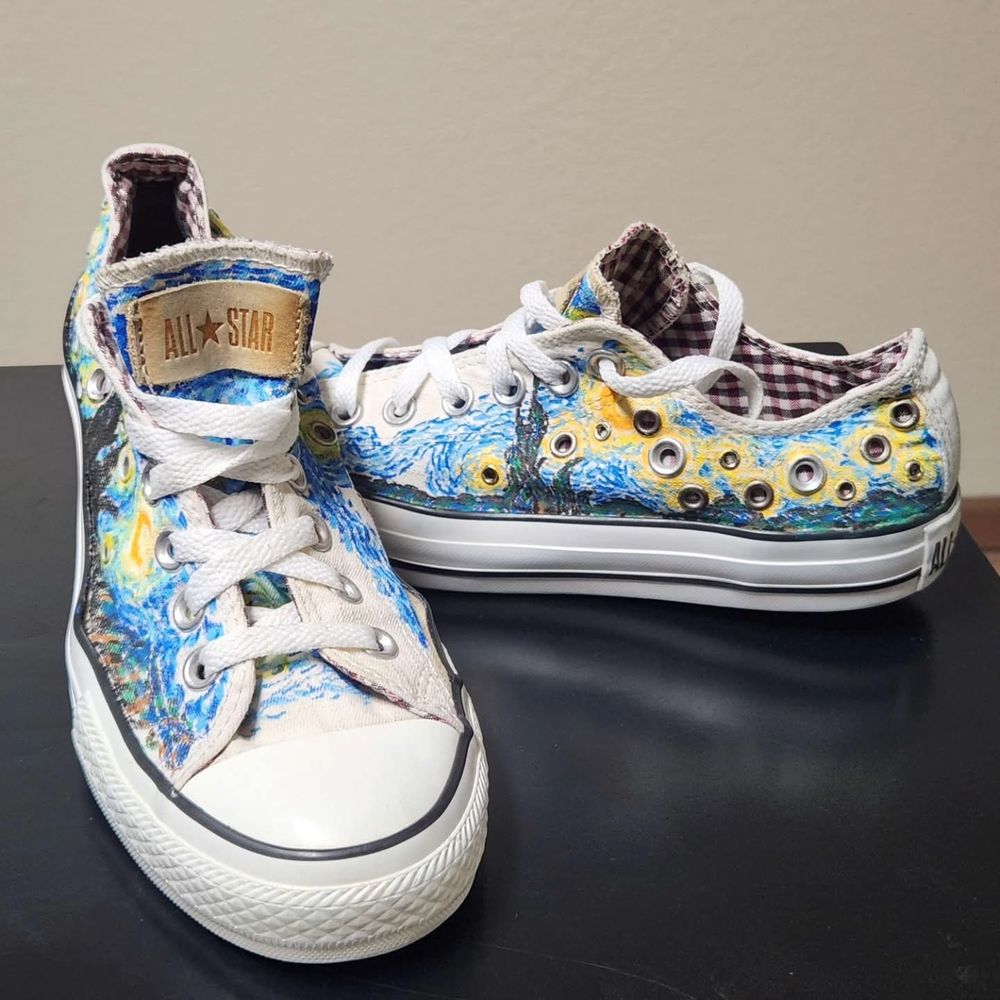 White Converse low top shoes with Starry Night painted on them. 