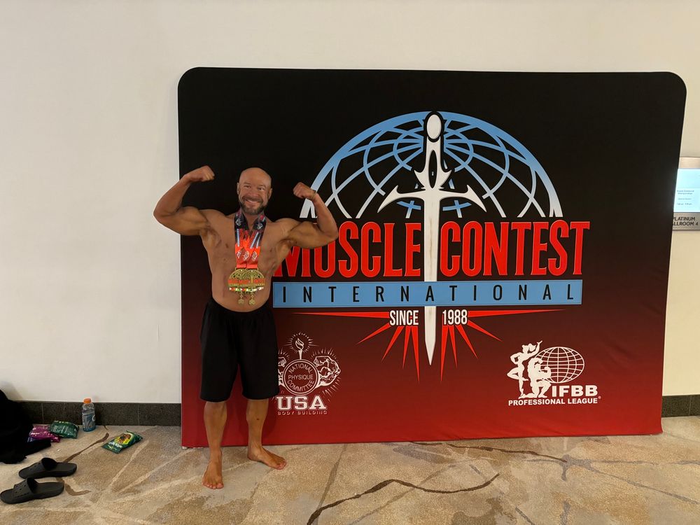 Kyle after finishing his first bodybuilding competition, taking home 2 medals!