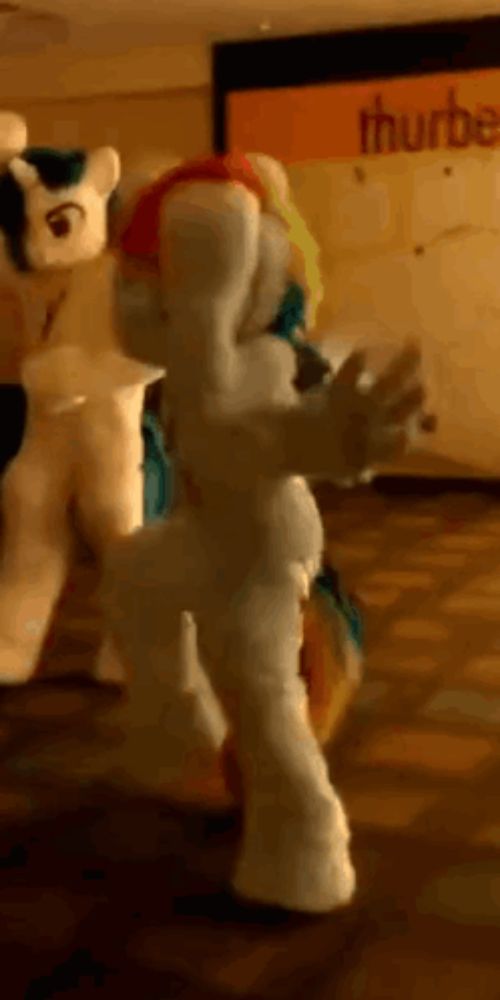 a person in a pony costume is standing in front of a sign that says thursday .