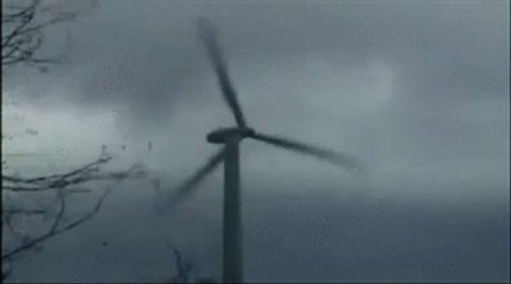 a plane is flying through a cloudy sky with a lot of smoke coming out of it .