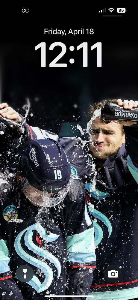 Phone screen picture of Joey Daccord dumping water on Jared McCann
