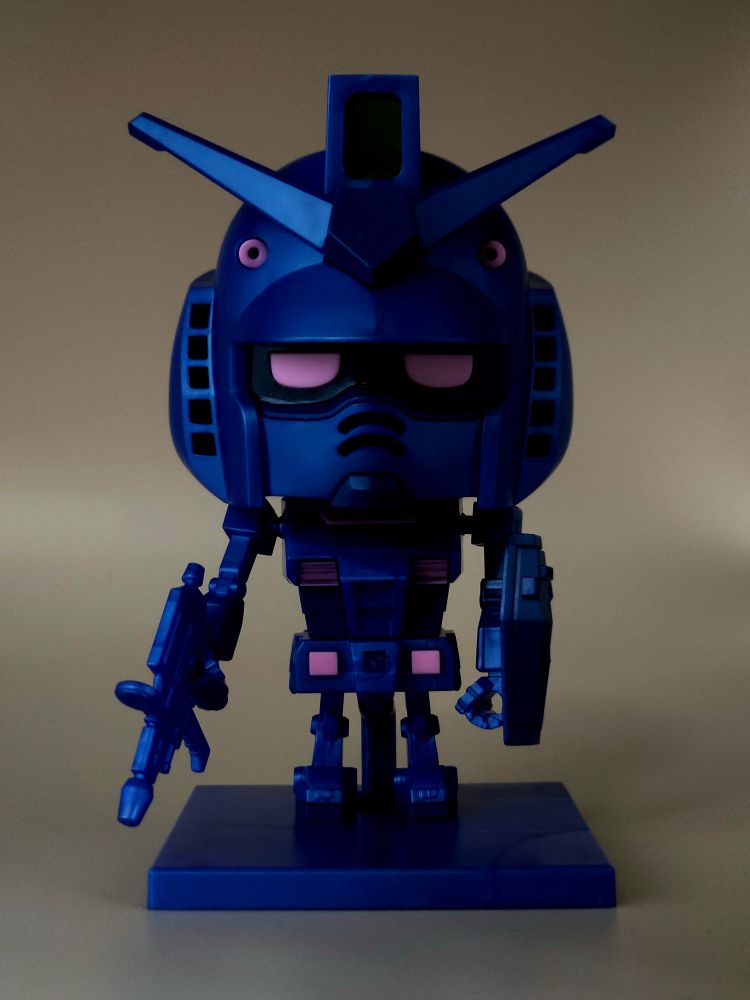 Gunpla-kun darkened to approximate the poster