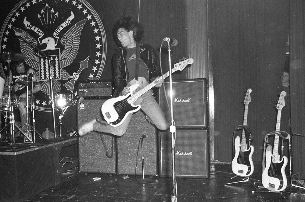 Vancouver punk mystery. I was scanning old negatives yesterday and came across this image of Dee Dee Ramone jumping during the Ramones Commodore Ballroom show. I noticed there is someone peering through the curtains above the guitars at right. Kind of looks like DOA’s Chuck Biscuits. Anyone recognize the person for certain?

.
.
#ramones #theramones #deedeeramone #commodore ballroom #vancouverpunk #punk #punkrock #yvrmusic #vancouverbc #dondentonphoto #dondentonphotography