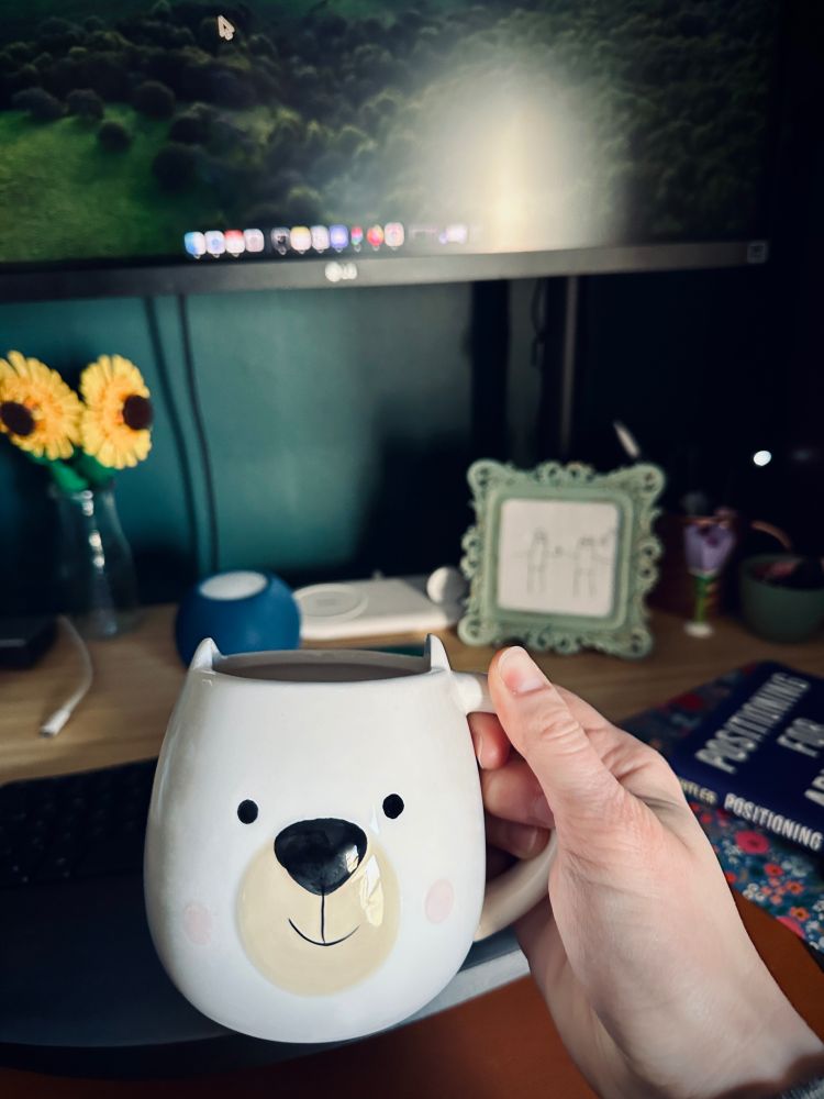 A polar bear coffee cup at desk 