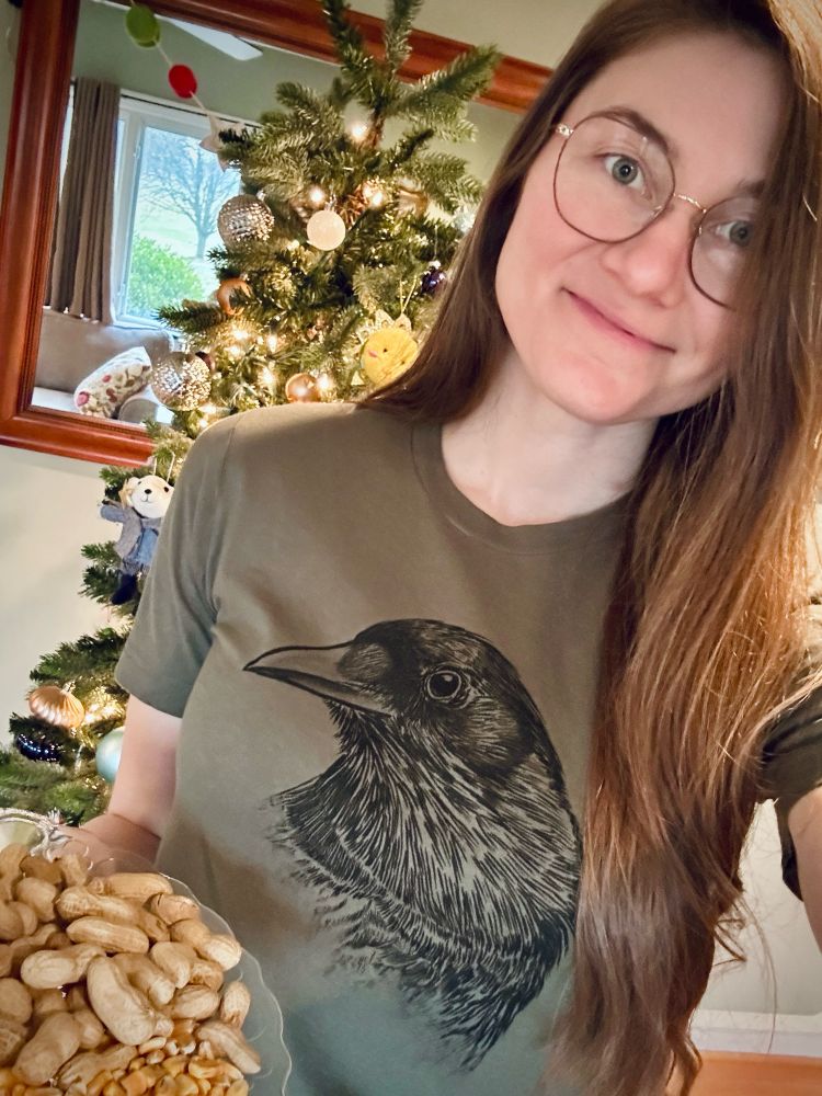 Joni Trythall selfie with crow tshirt and food platter 