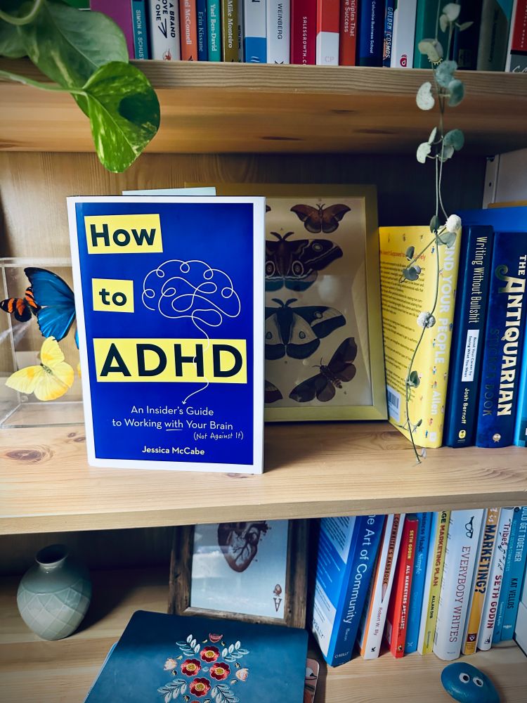 "How to ADHD" book displayed on bookshelf