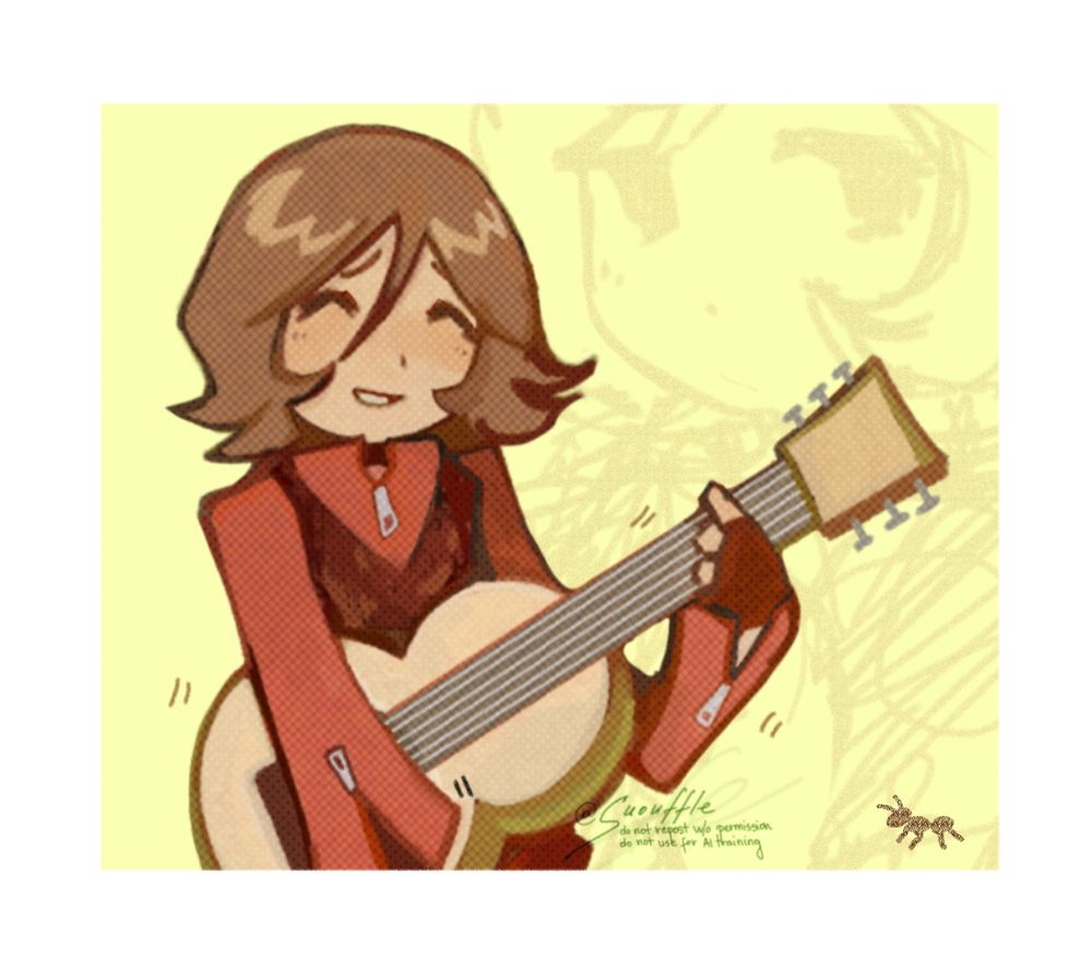 Tatsuya playing guitar.