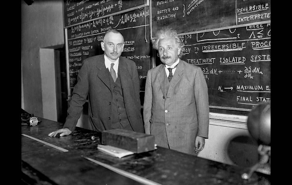 Jan. 8, 1932: Dr. Richard C. Tolman, left, and professor Albert Einstein stand in front of a blackboard at Caltech. Tolman led a seminar at Caltech for more than 50 scientists.
