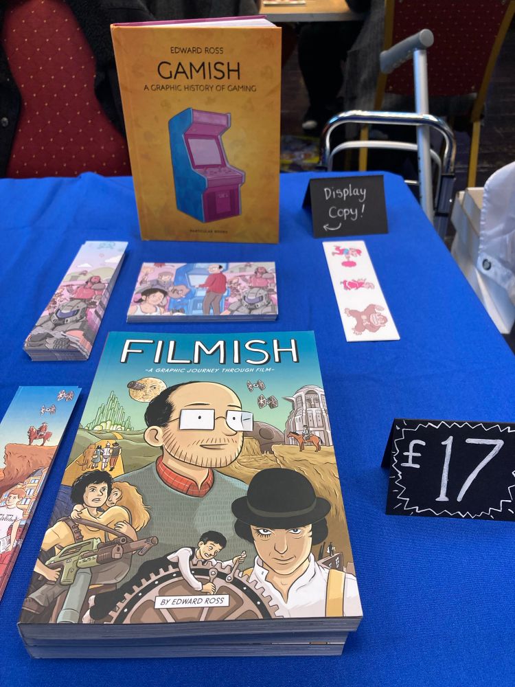 Convention table featuring my graphic novels Gamish: The graphic history of gaming, and Filmish: a graphic journey through film. 