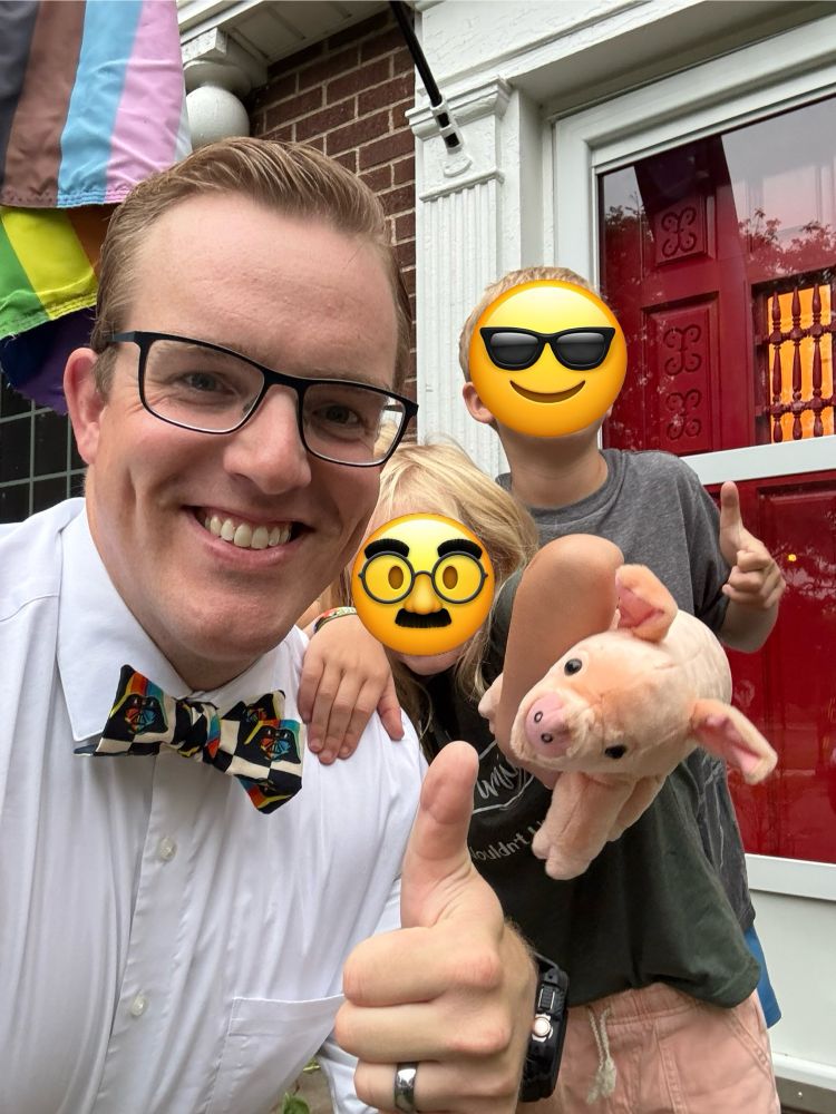 Proud dad celebrating his first day of a new job with his two children