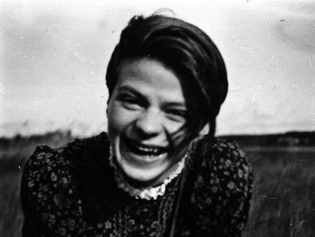 A young Sophie Scholl, smiling with all the joy in the world.