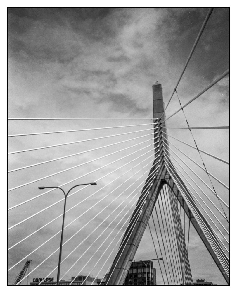 In traffic trying to leave Boston late one summer afternoon. looking up at the bridge and the clouds with a lamp and the Converse building in the very bottom right - yes this is a re-edit and among the frames I did post from this roll but had to re-shoot and I like it so much I had to post it again