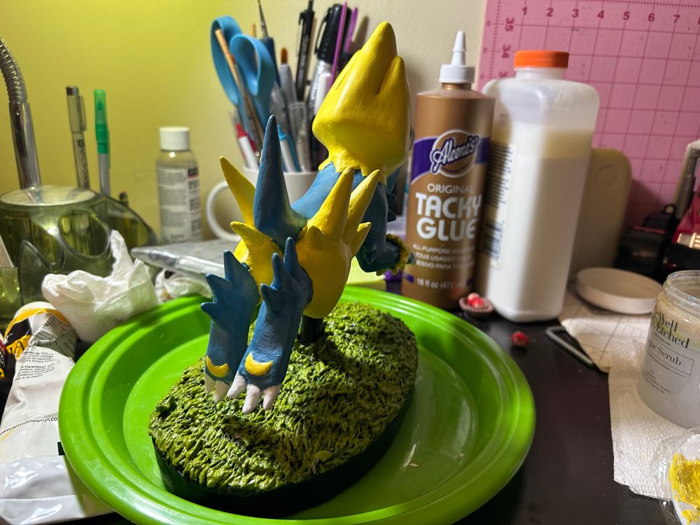 the sculpture viewed from behind. did you know manectric has crescent shaped paw beans? :)