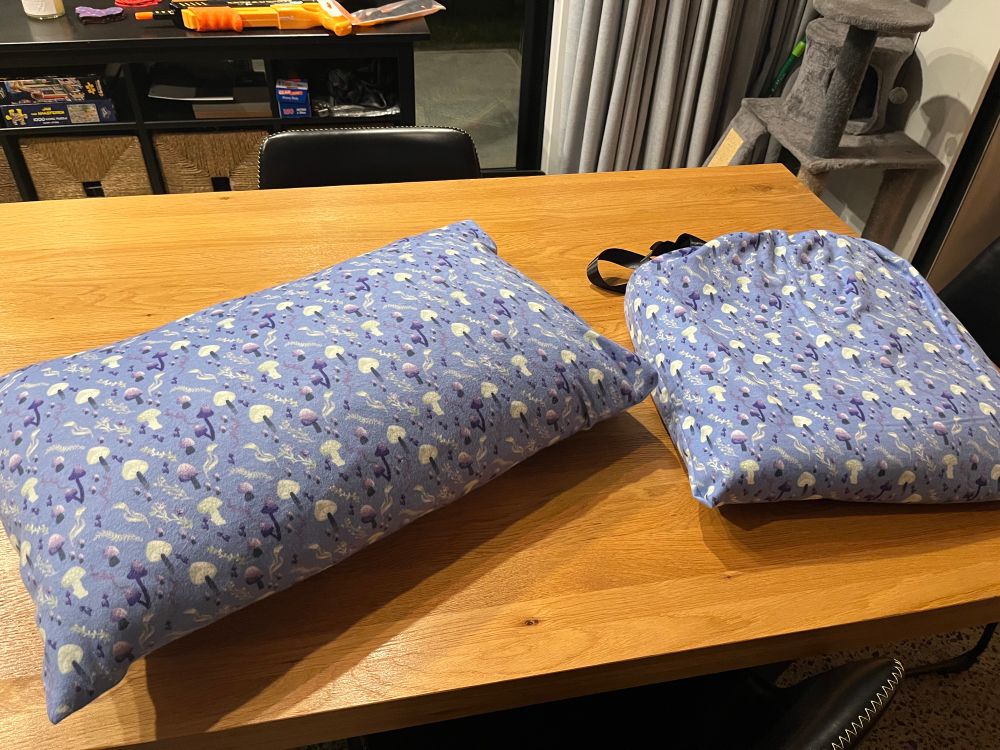 The pillowcase and drawstring bag in matching purple fairy mushroom fabric