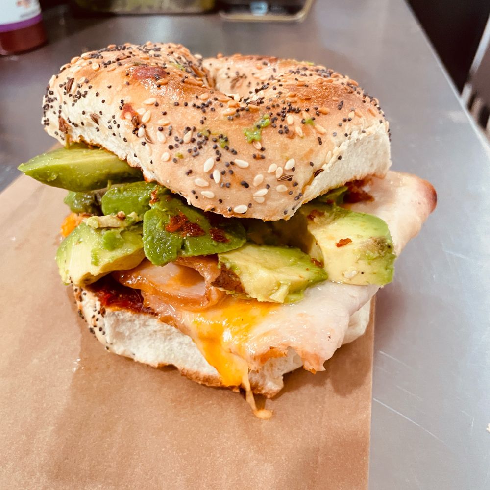 The Cheesy Bird with Avocado on an Everything Bagel at souvenir Cafe San francisco!  
