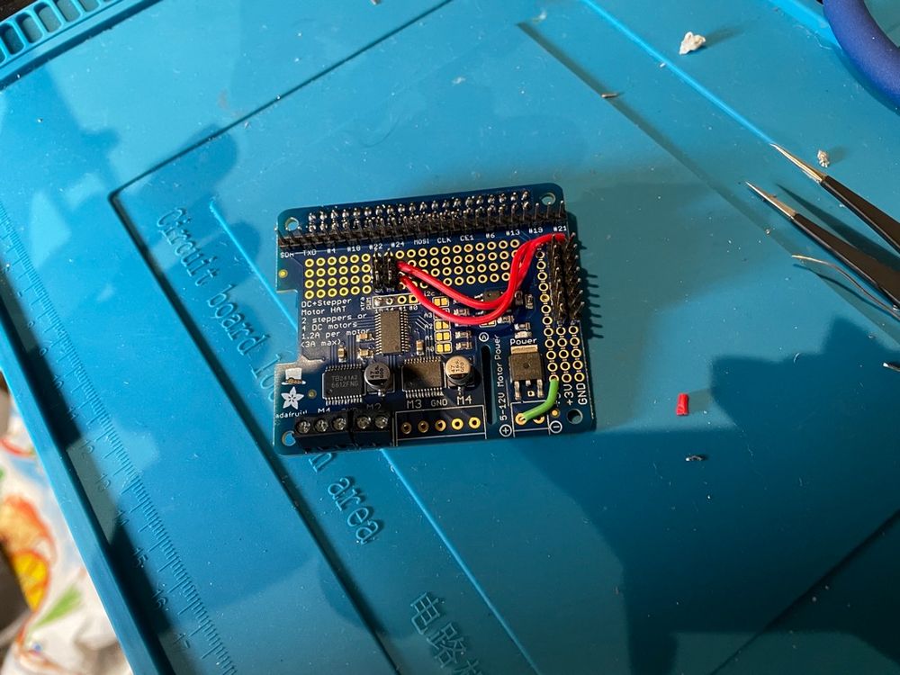 The Adafruit Stepper Motor hat for Raspberry Pi. I've soldered a bunch of stuff there so I can run it from the same supply as the Pi and for servo breakout. 70+ solder connections though...