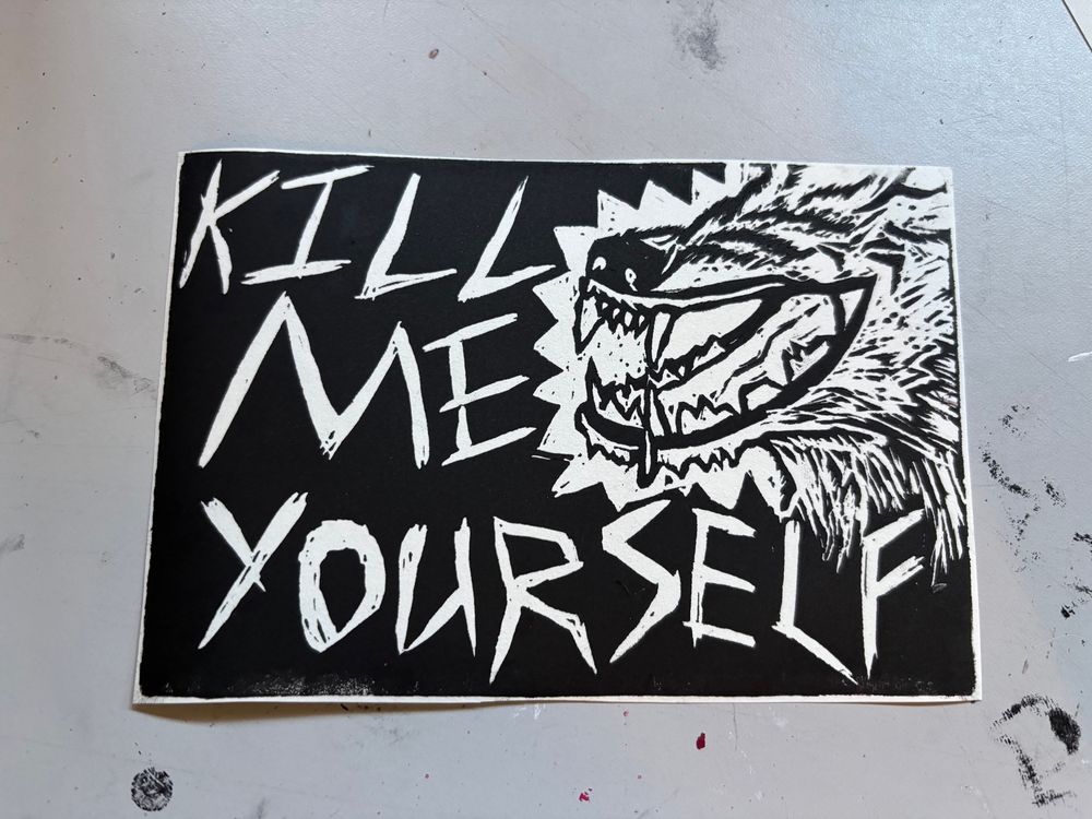 Linocut print of a snarling wolf with the text kill me yourself