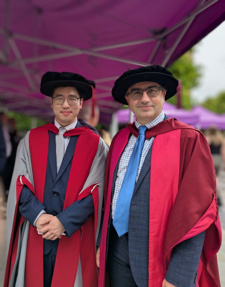 Wookyung Kim, my former PhD student, and I, in our doctoral gowns.