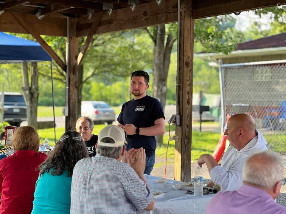 A closer shot of candidate Daynon Foster and the seated attendees closest to him.