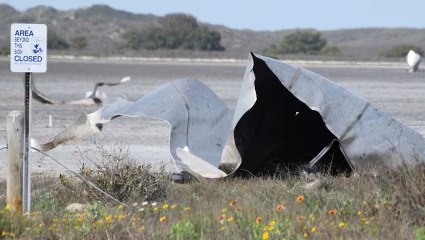 Debris is seen in the Boca Chica national wildlife refuge after the SpaceX Starship prototype rocket failed to land safely on 31 March, 2021.