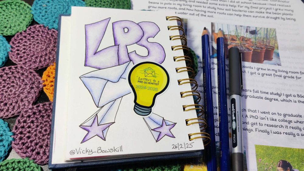 Photo of a doodle journal page with the letters 'LPS', an envelope and the 2024-25 light bulb sticker from Letters to a Pre-Scientist