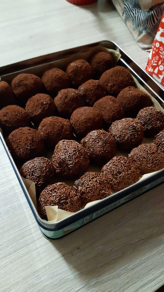A tin of homemade Scottish rum truffles finished variously in chocolate vermicelli and a coconut/cocoa mix.