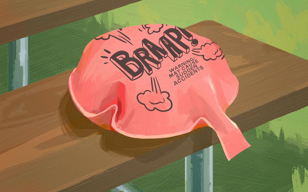 digital painting of a whoopee cushion sitting on a brown picnic table bench with green grass behind it. The cushion reads "BRAAP! WARNING: MAY CAUSE SUDDEN ACCIDENTS"